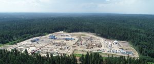 Aerial photo of an industrial field in the middle of a forest